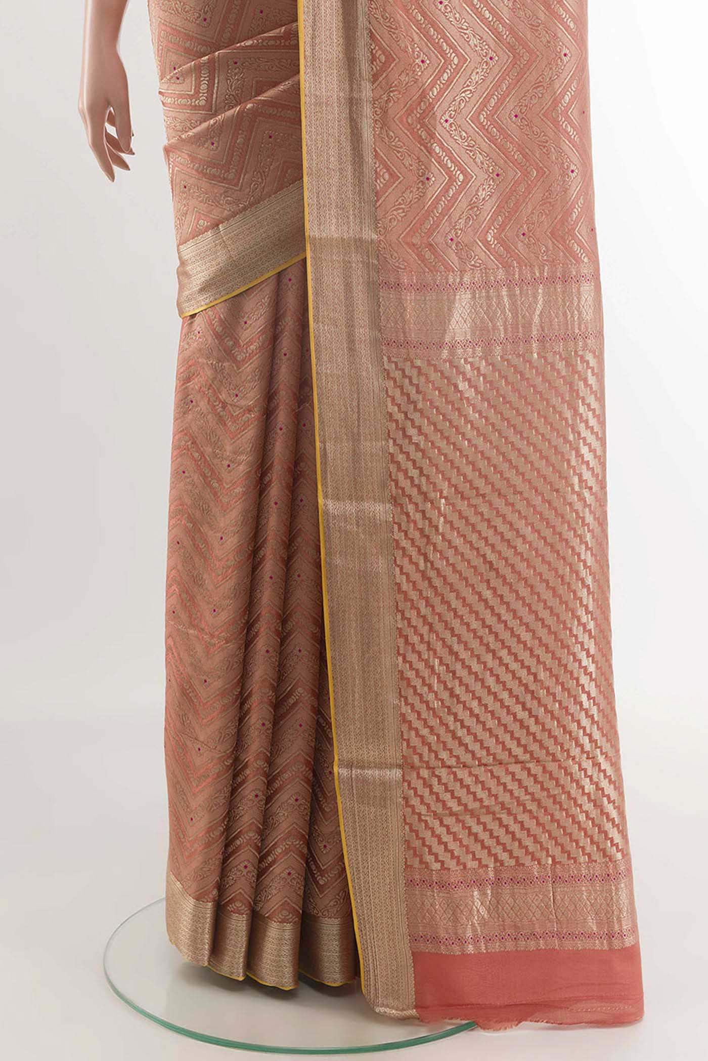 Pleats and pallu of Peach Mysore Crepe Saree with Zari Brocade on the body and Zari Border