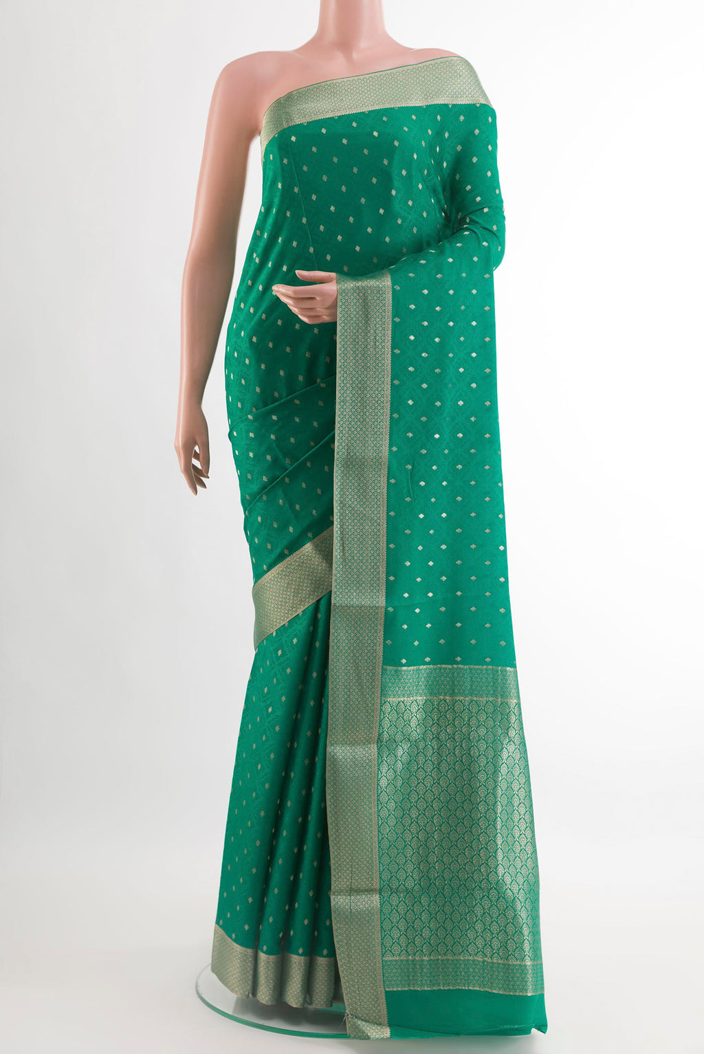 Green Mysore Crepe Saree with Zari Butta on the body and Plain Border.  displayed on a mannequin