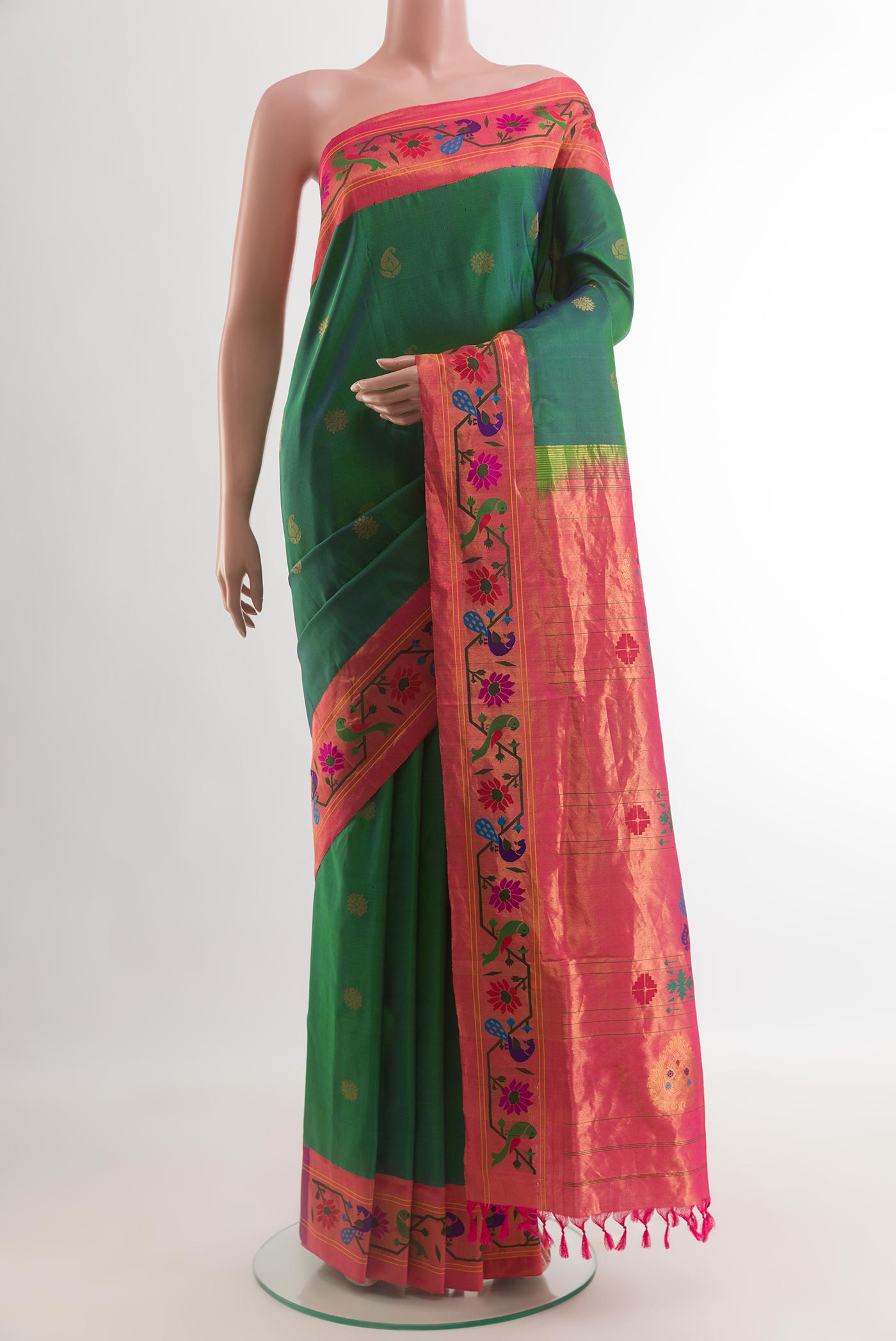 Green Gadwal Silk Saree with Zari Butta on the body and Paithani Border.  displayed on a mannequin