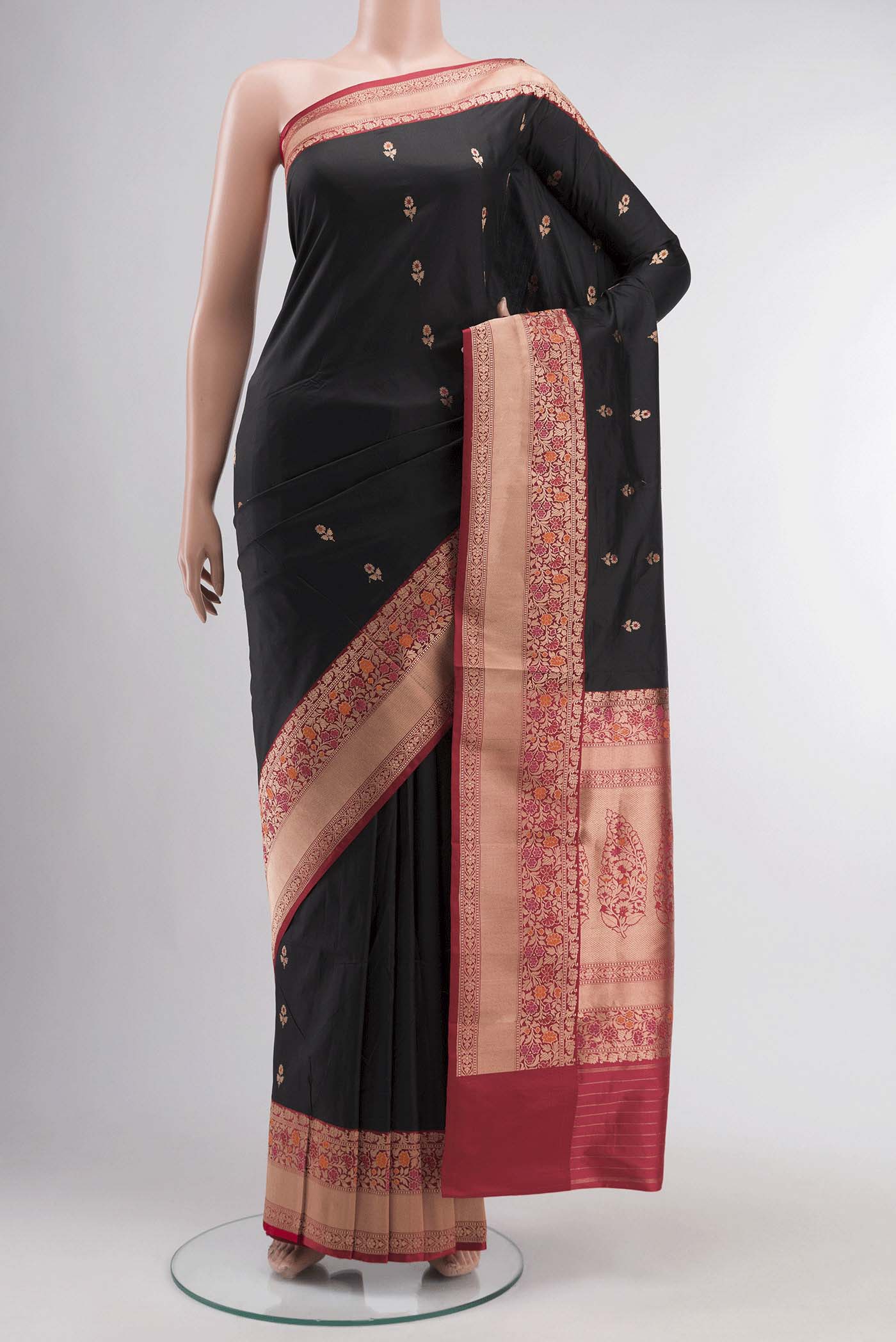 Black Banarasi Katan Silk Saree with Zari Butta on the body and Zari Border displayed on a mannequin