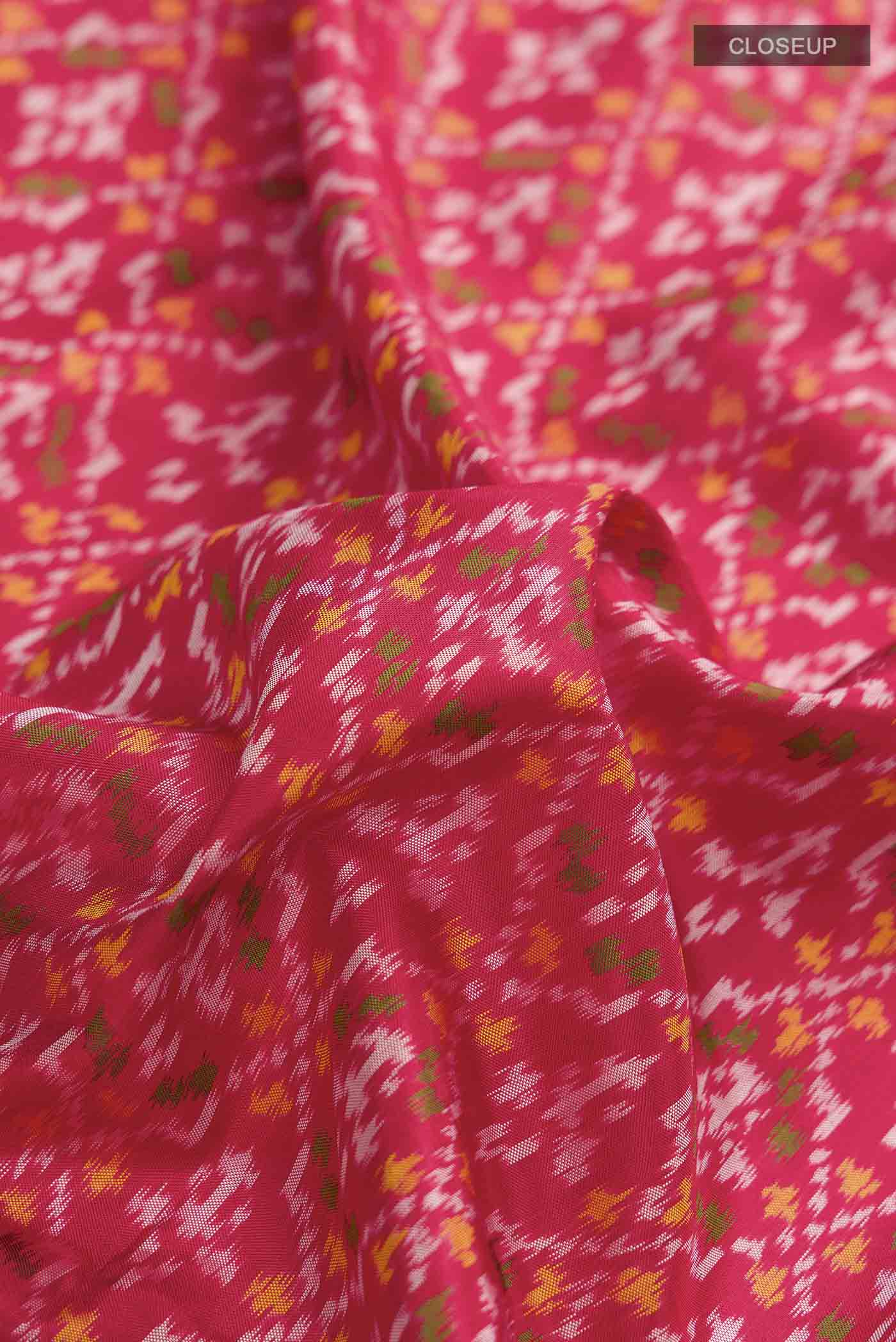 Close up of Red Rajkot Patola Silk Saree with Pure Ikat on the body and Embroidery Border displaying folds