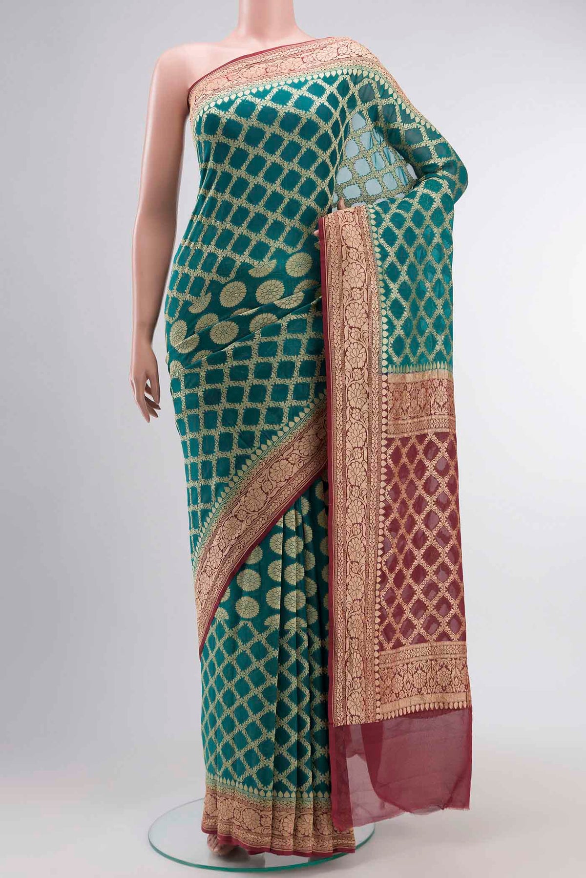 Green Banarasi Georgette Saree with Zari Butta on the body and Zari Border displayed on a mannequin