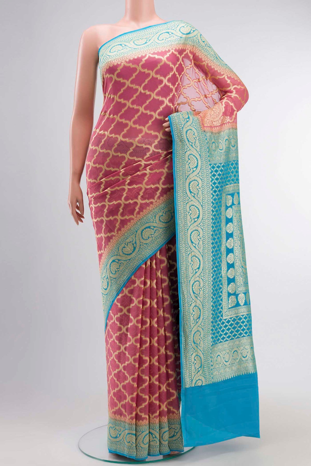 Pink Banarasi Georgette Saree with Zari Butta on the body and Zari Border displayed on a mannequin