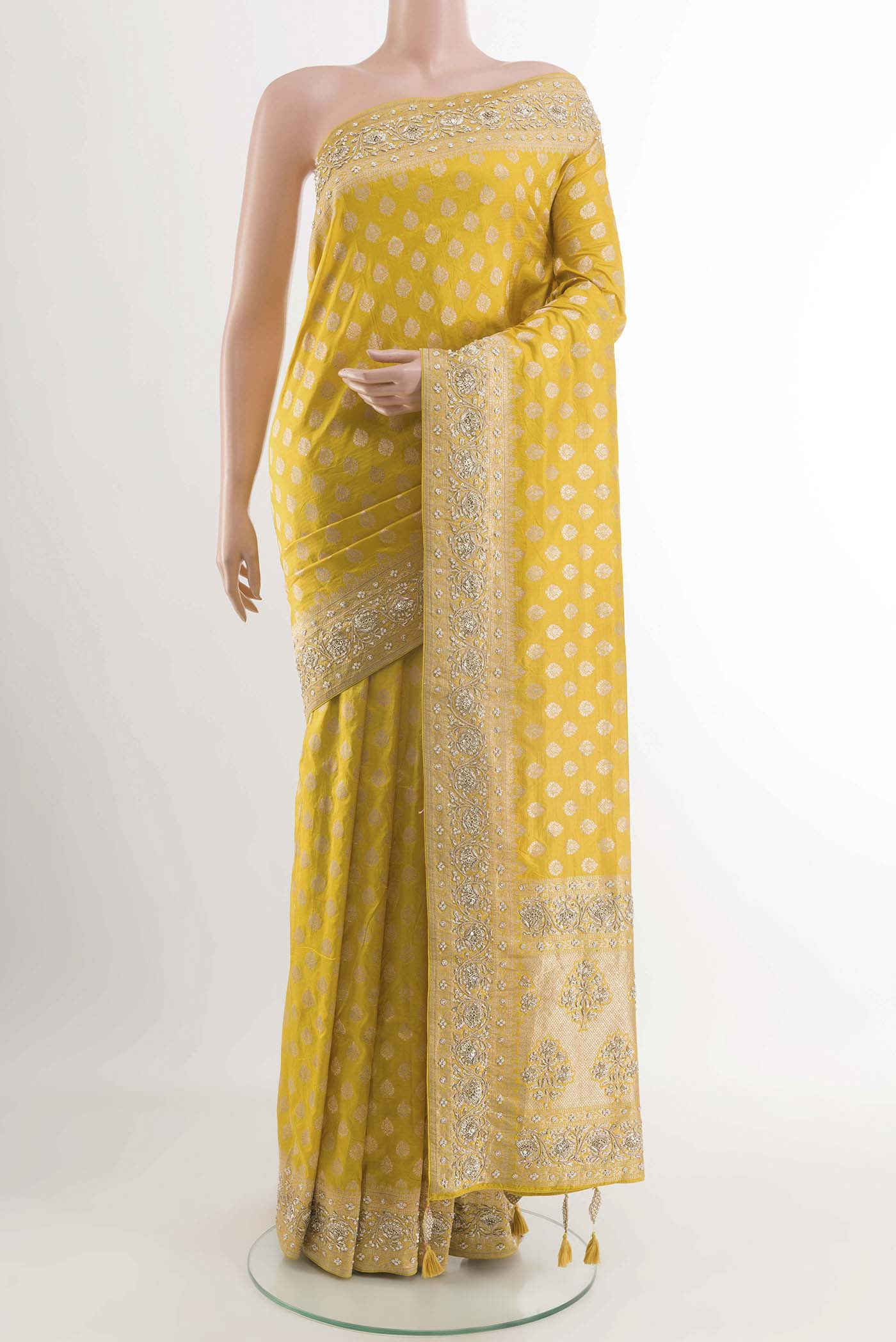 Yellow Banarasi Silk Saree with Zari Butta on the body and Sequin Border displayed on a mannequin