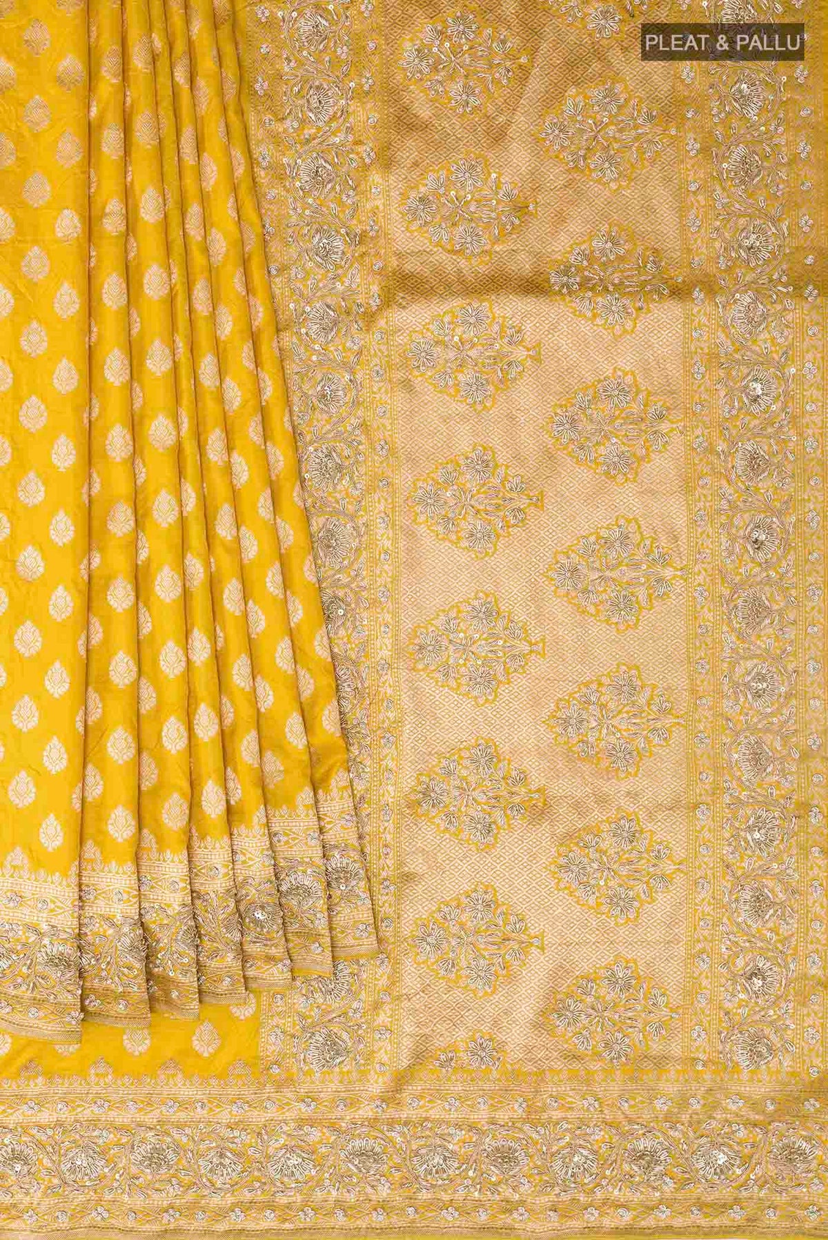 Pleats and pallu of Yellow Banarasi Silk Saree with Zari Butta on the body and Sequin Border
