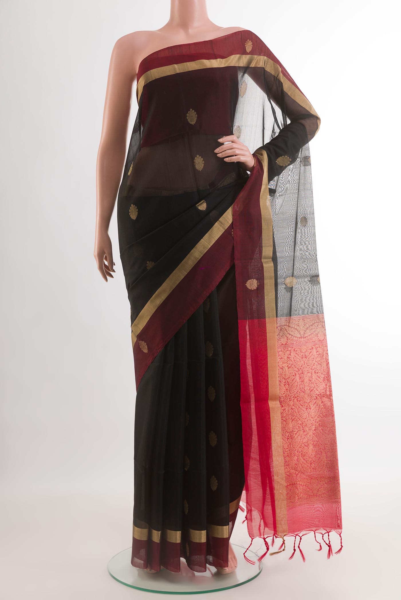 Black Silk Cotton Saree with Zari Butta on the body and Zari Border.  displayed on a mannequin