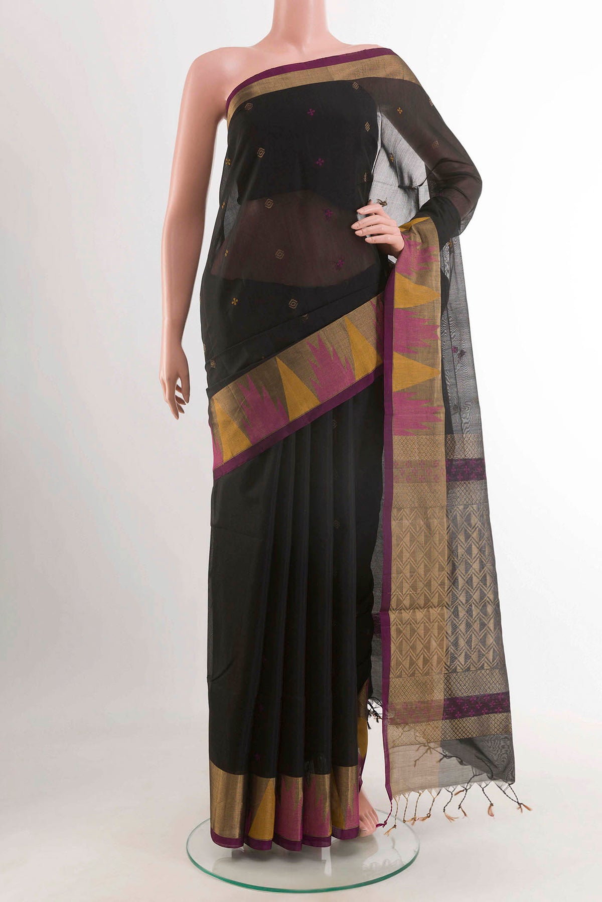 Black Blended Kora Cotton Saree with Zari And Thread Butta on the body and Zari Border displayed on a mannequin