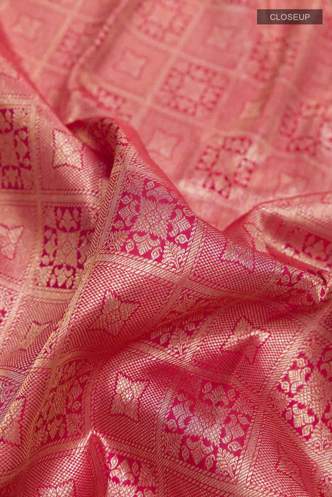 Close up of Red Kanchipuram Silk Saree with Zari Brocade on the body and Zari Border displaying folds