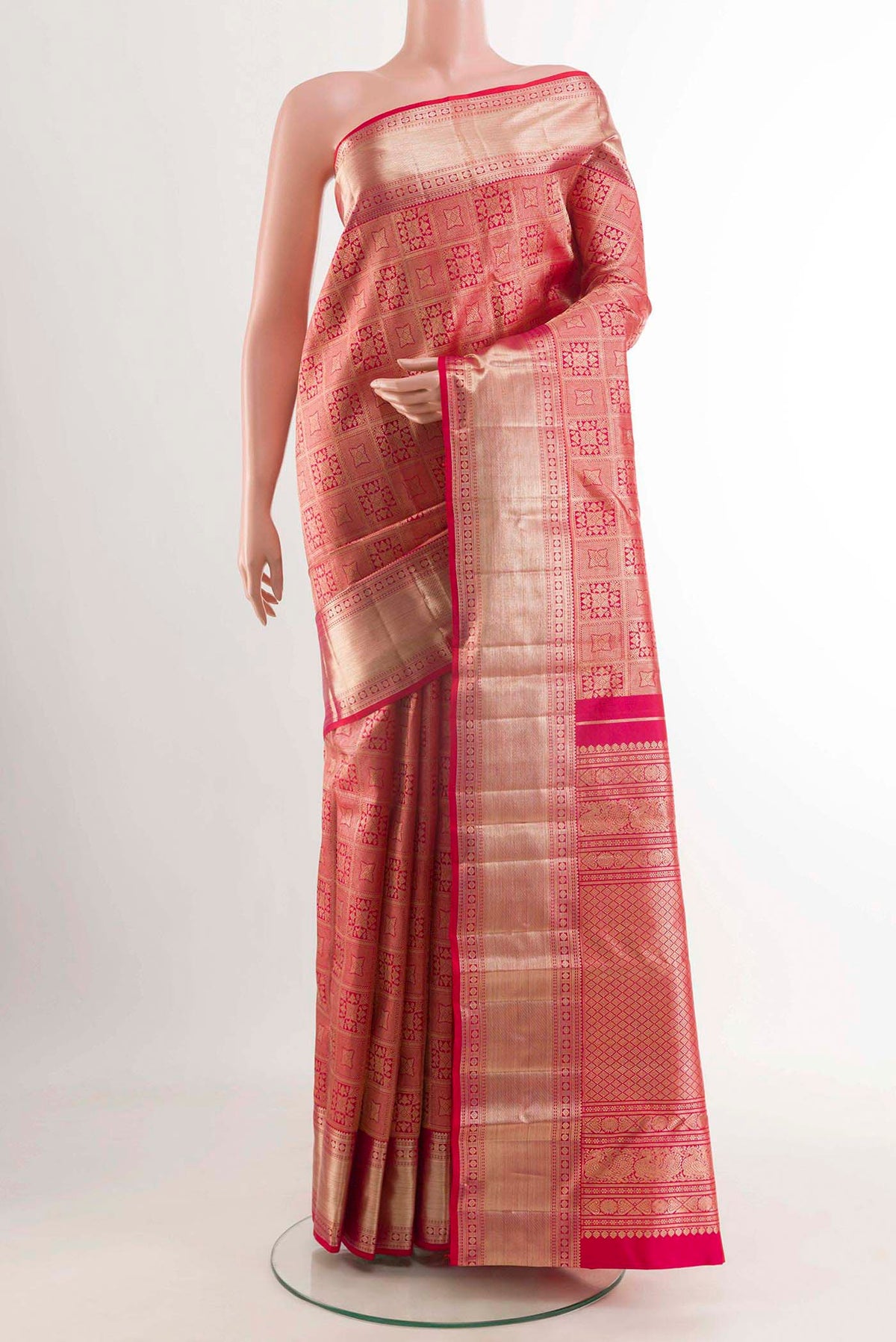 Red Kanchipuram Silk Saree with Zari Brocade on the body and Zari Border displayed on a mannequin