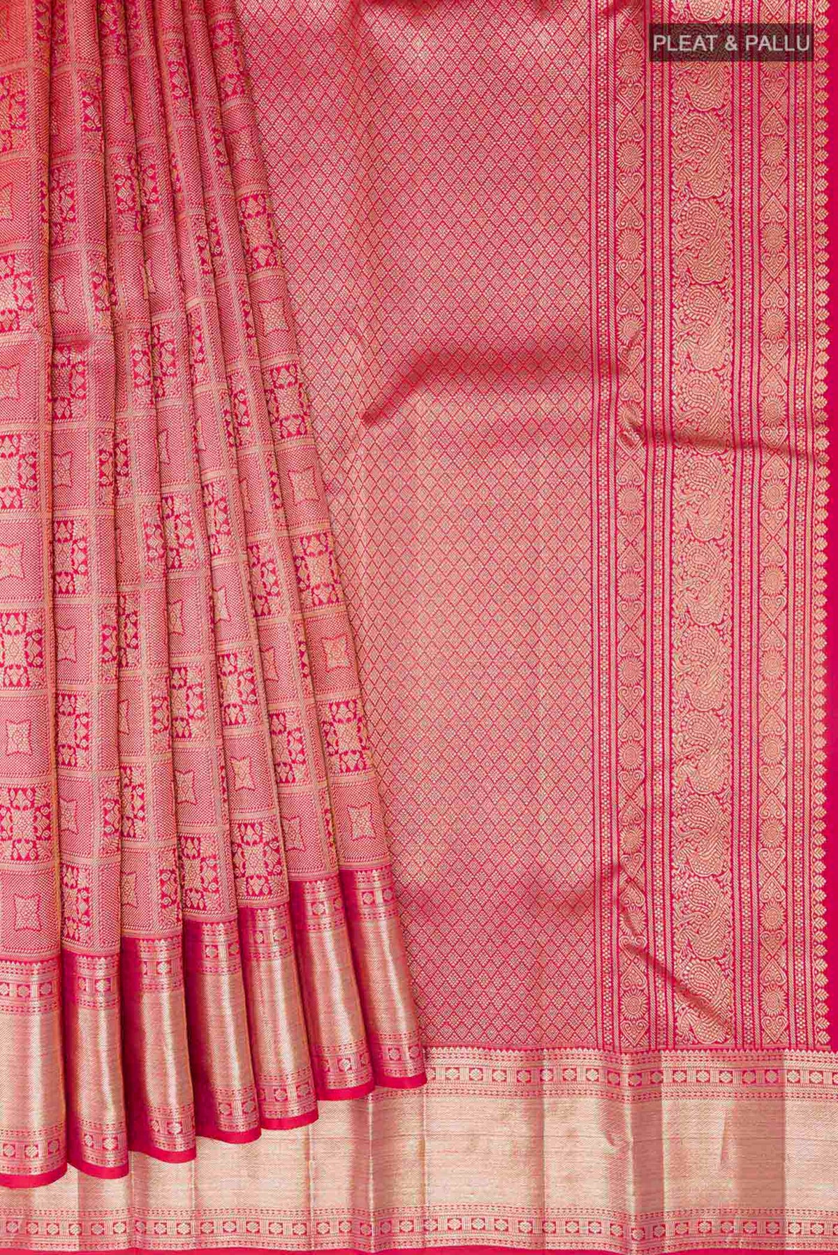 Pleats and pallu of Red Kanchipuram Silk Saree with Zari Brocade on the body and Zari Border