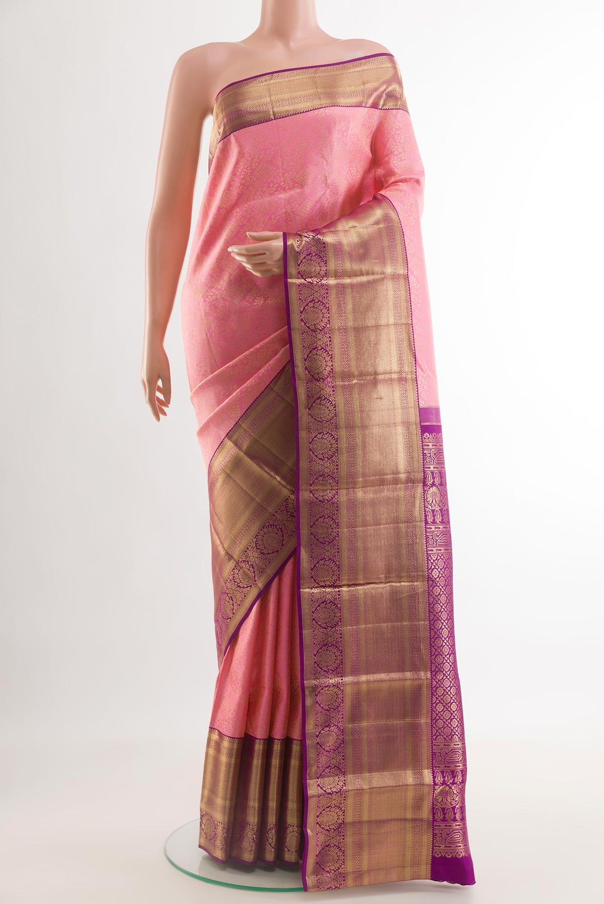 Rose pink Kanchipuram Silk Saree with Zari Brocade on the body and Zari Border.  displayed on a mannequin