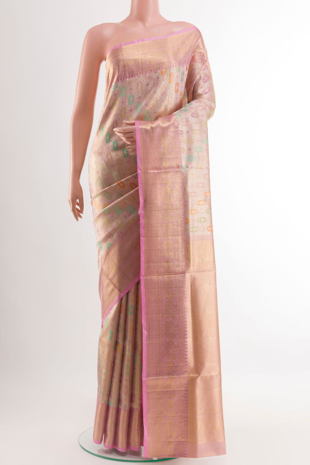 Rose Gold Kanjivaram Tissue Silk Saree with Zari Brocade on the body and Zari Border.  displayed on a mannequin