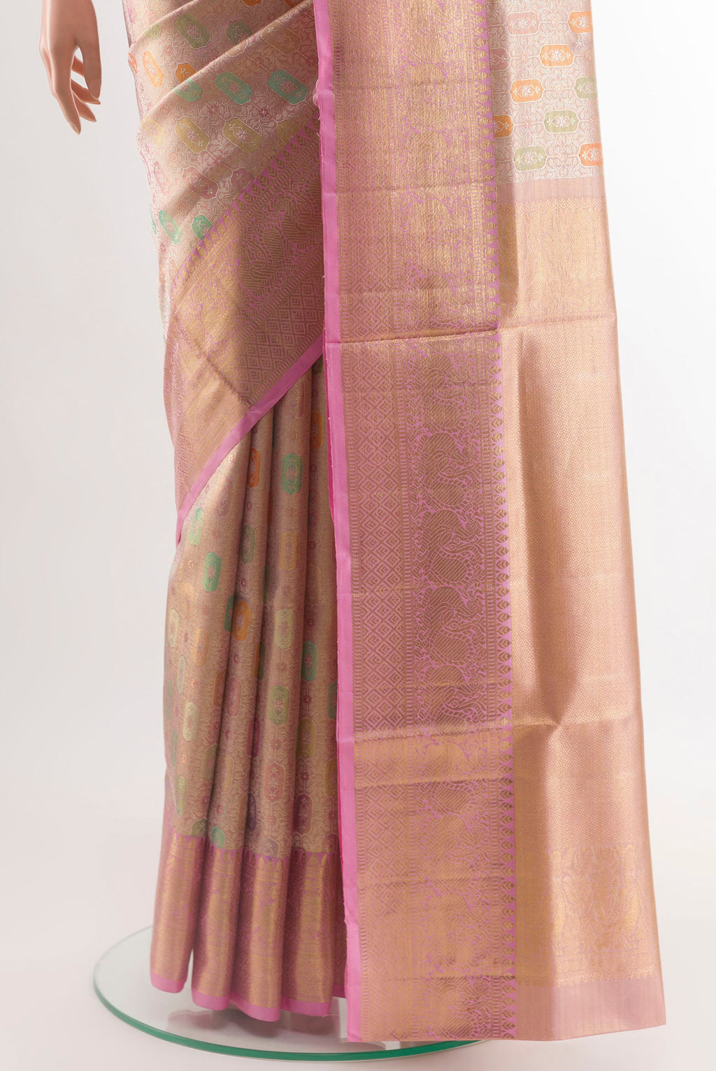 Pleats and pallu of Rose Gold Kanjivaram Tissue Silk Saree with Zari Brocade on the body and Zari Border. 