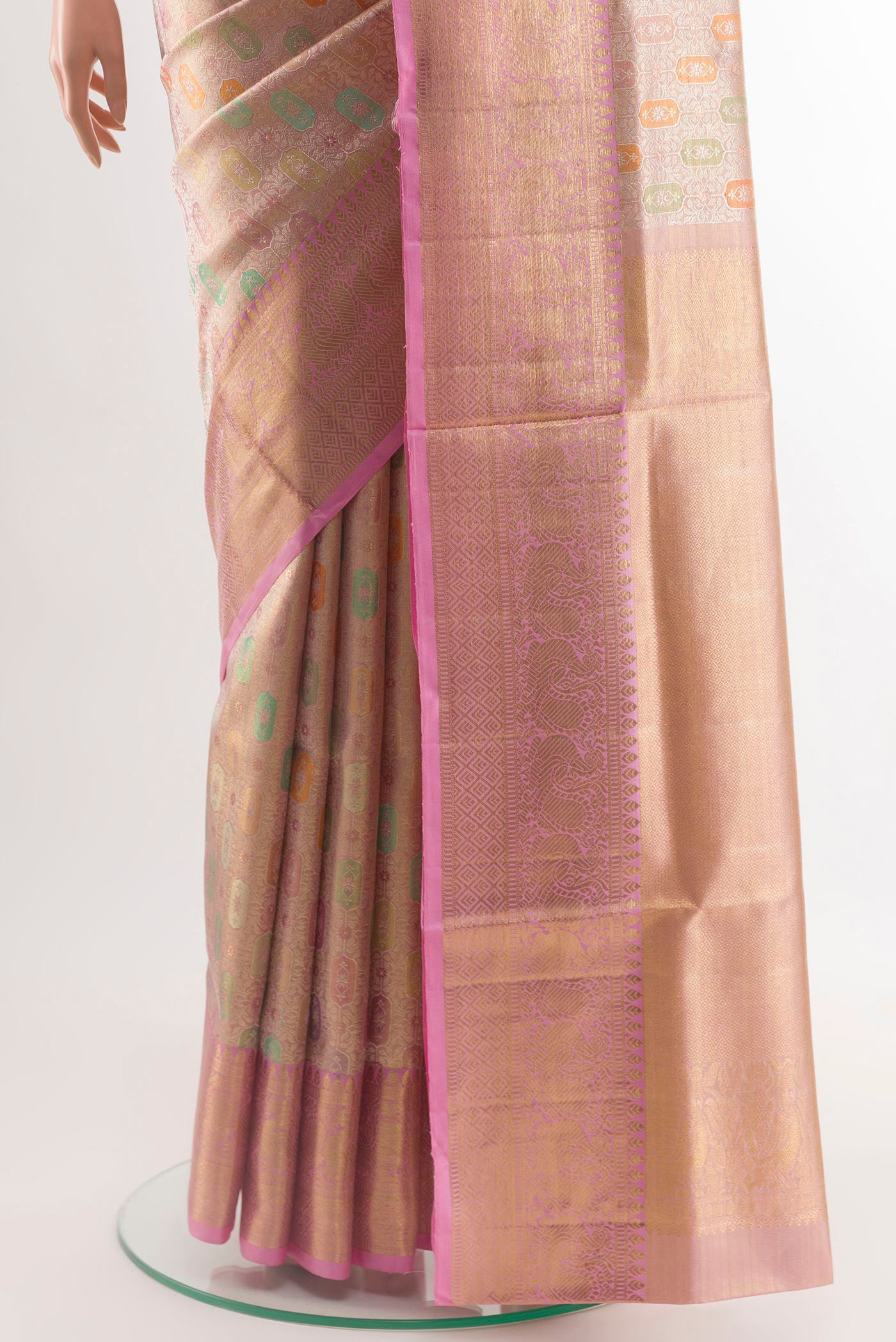 Pleats and pallu of Rose Gold Kanjivaram Tissue Silk Saree with Zari Brocade on the body and Zari Border. 