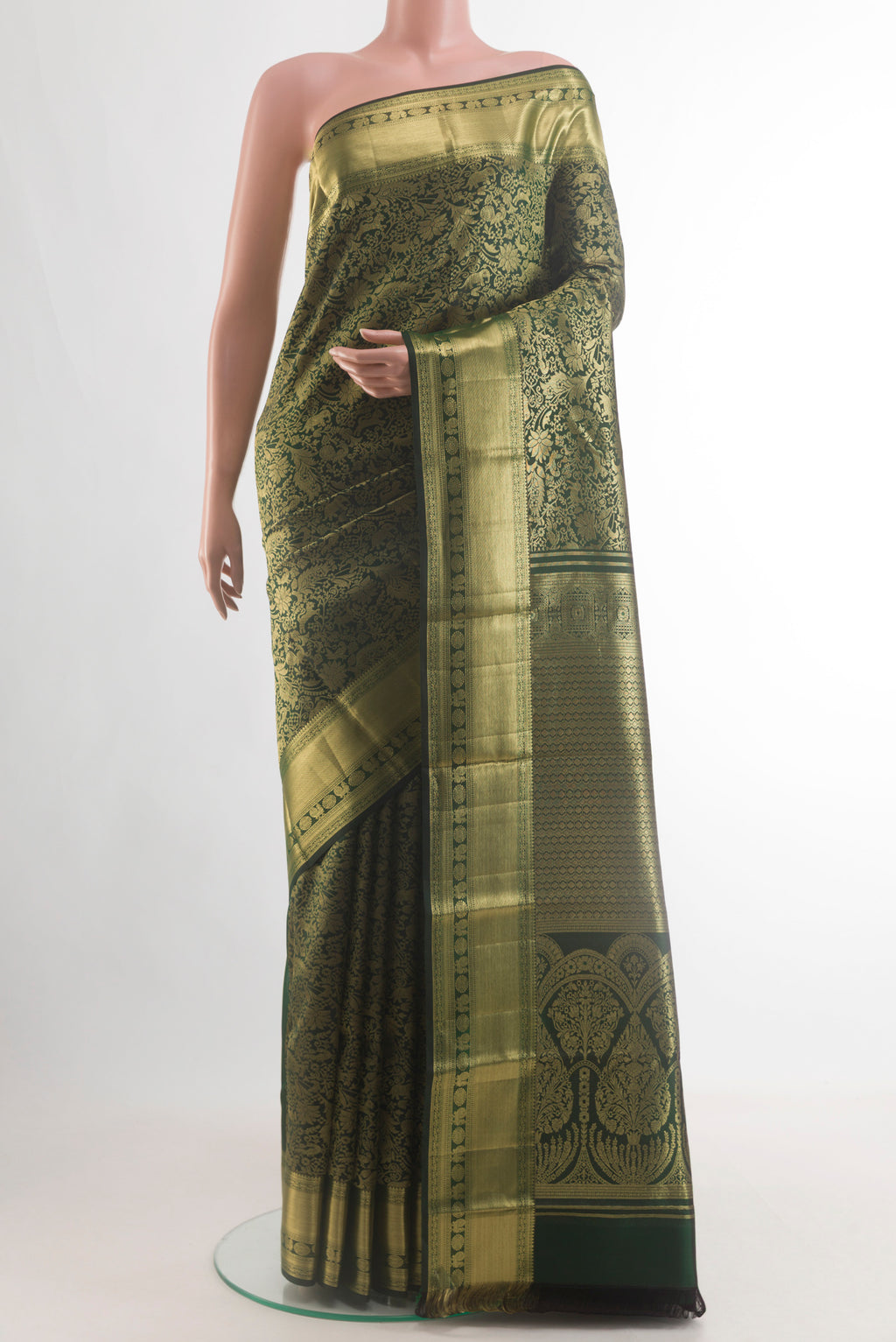 Pure Silk Bottle Green Kanchipuram Saree with Zari Brocade on the body and Zari Border.  displayed on a mannequin