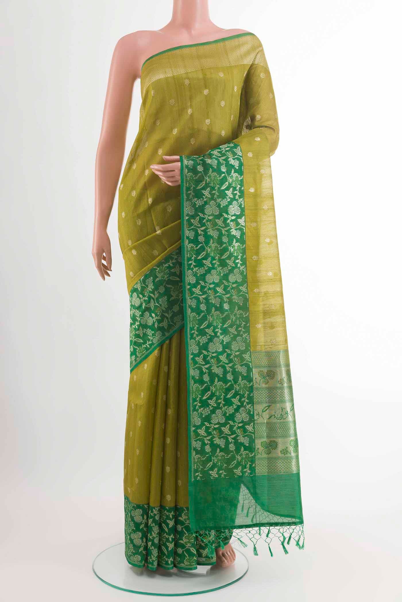Pickle Green Banarasi Tussar Silk Saree with Zari Butta on the body and Zari Border displayed on a mannequin