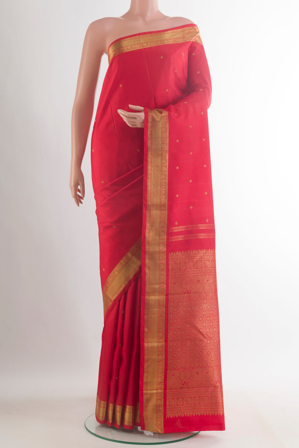 Pure Silk Pure Zari Red Kanchipuram Saree with Zari Butta on the body and Zari Border.  displayed on a mannequin