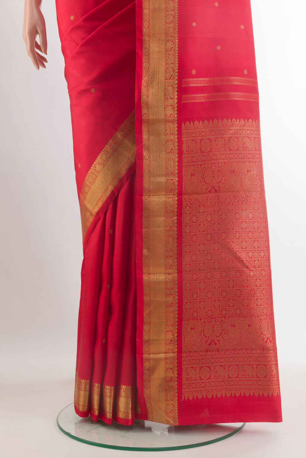 Pleats and pallu of Pure Silk Pure Zari Red Kanchipuram Saree with Zari Butta on the body and Zari Border. 