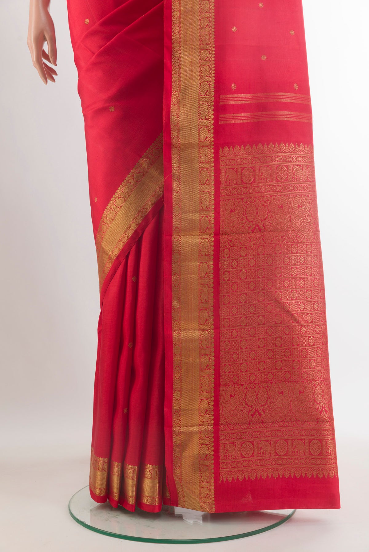 Pleats and pallu of Pure Silk Pure Zari Red Kanchipuram Saree with Zari Butta on the body and Zari Border. 