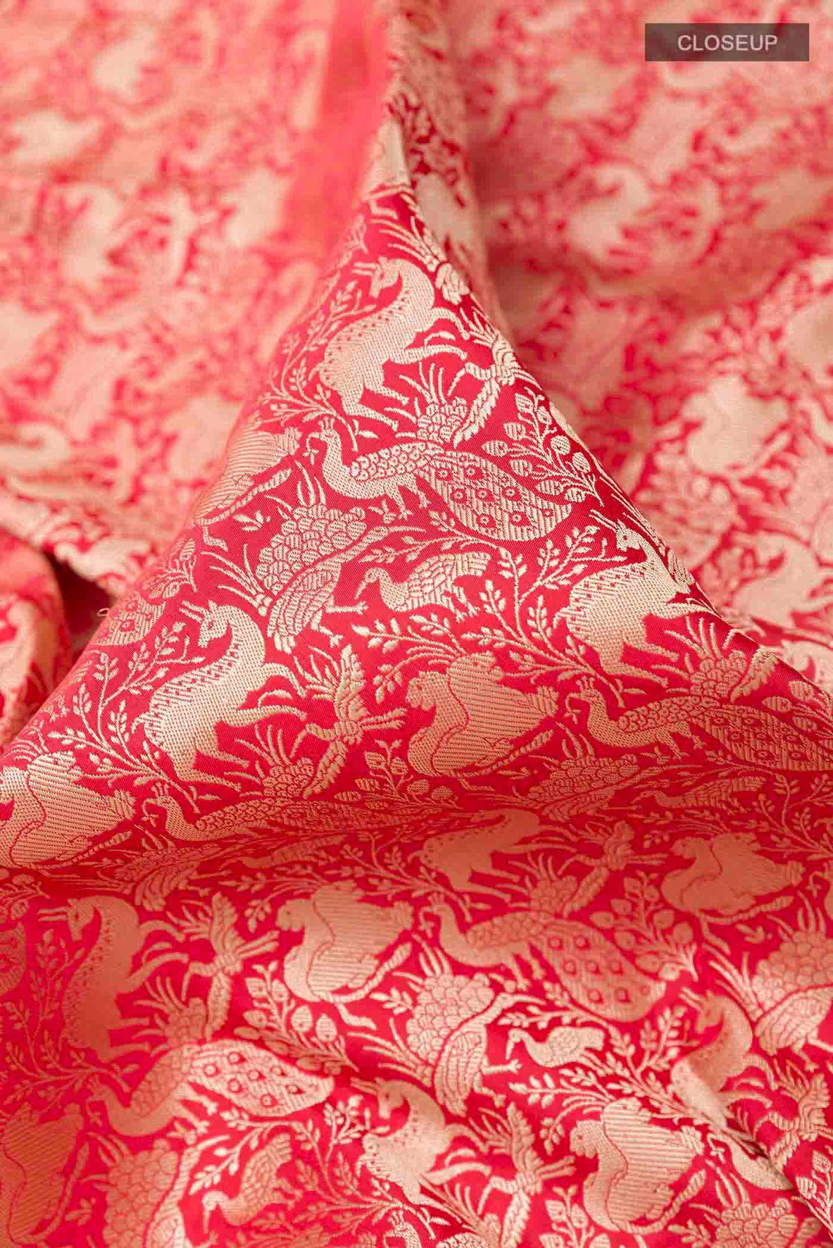 Close up of Red Banarasi Silk Saree with Stripes on the body and Zari Border displaying folds