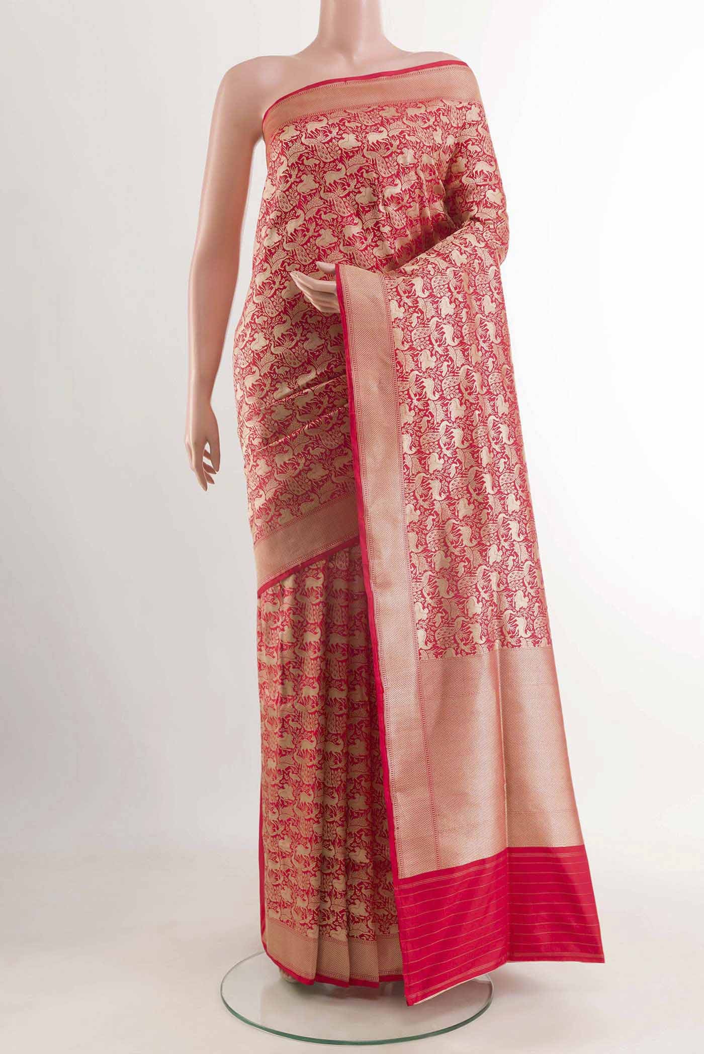 Red Banarasi Silk Saree with Stripes on the body and Zari Border displayed on a mannequin