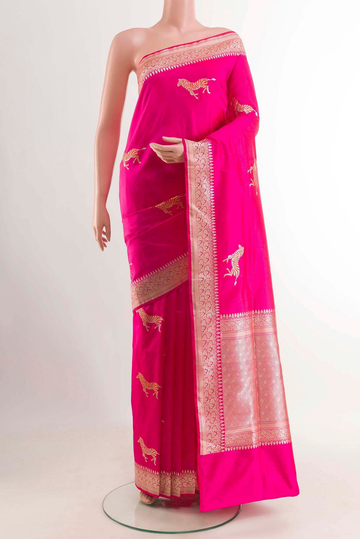 Pink Banarasi Silk Saree with Zari Butta on the body and Zari Border displayed on a mannequin