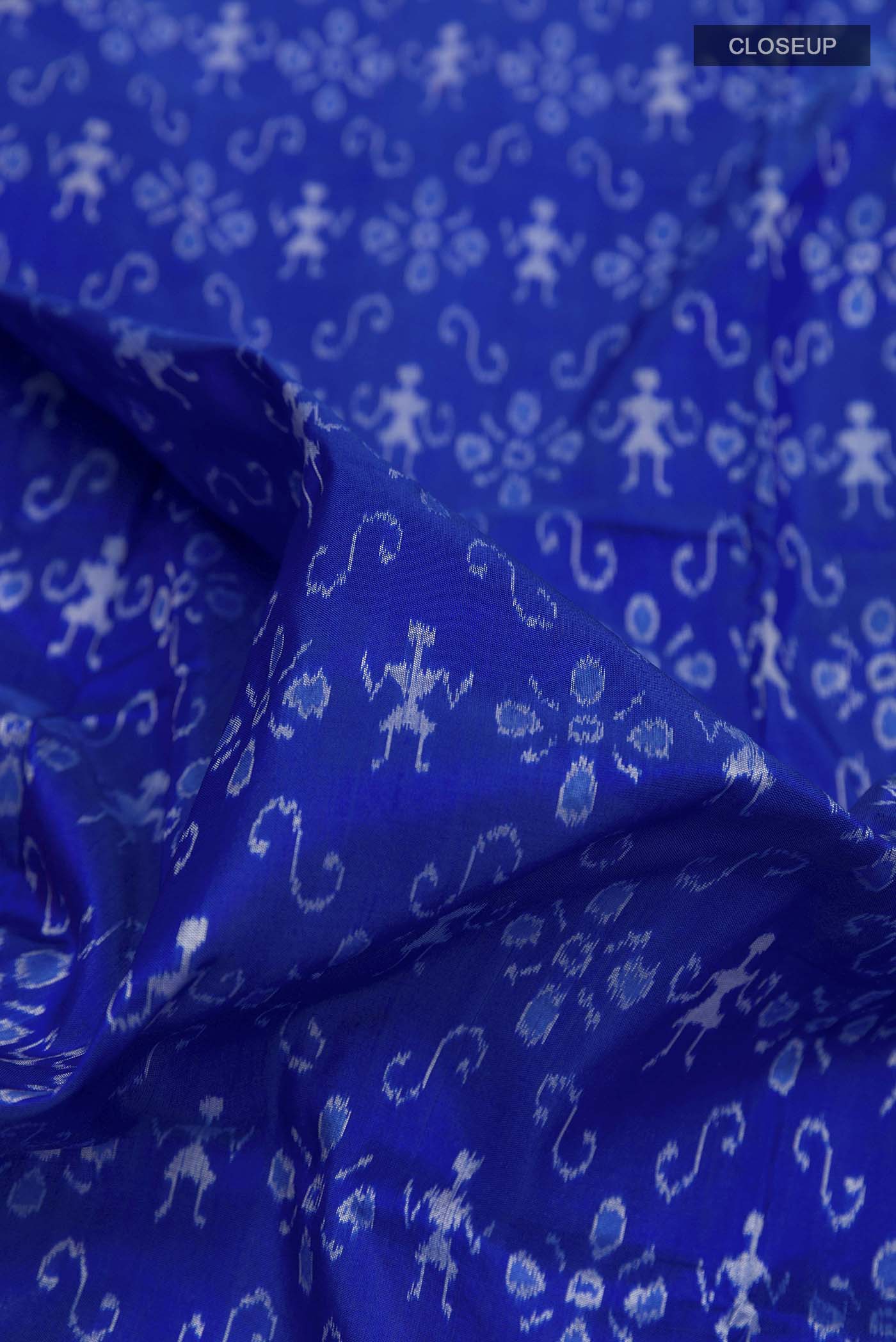 Close up of Blue Orissa Silk Saree with Pure Ikat on the body and Thread Border displaying folds