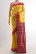 Yellow Orissa Silk Saree with Thread Butta on the body and Thread Border.  displayed on a mannequin