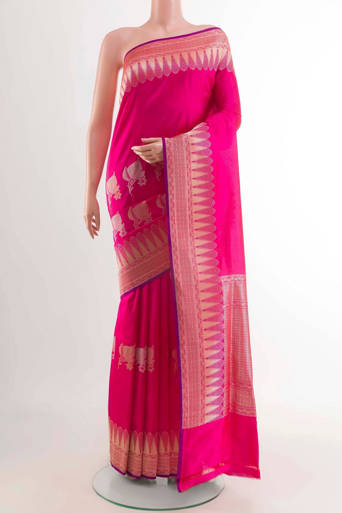 Pink Banarasi Saree with Zari Butta on the body and Zari Border displayed on a mannequin