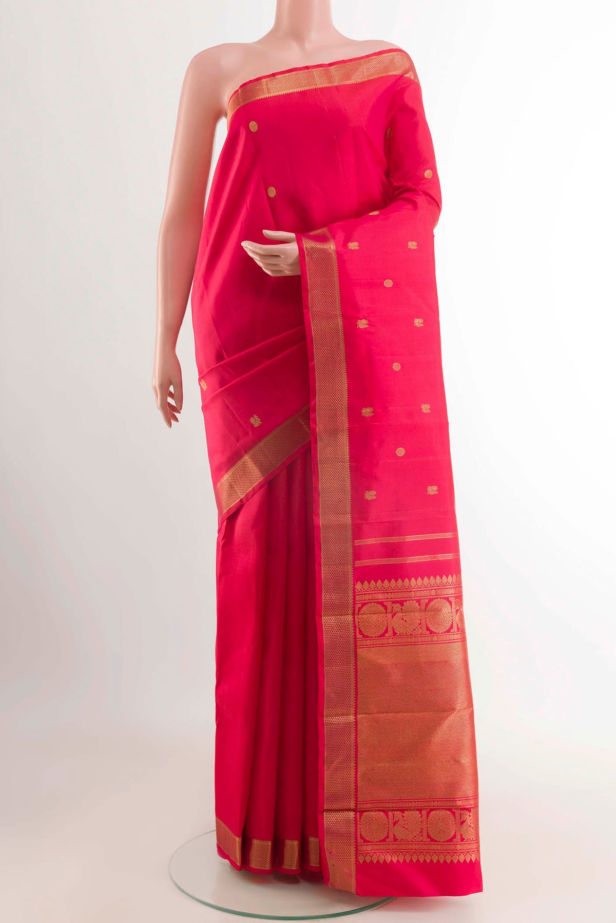 Pink Kanchipuram Silk Saree with Zari Butta on the body and Zari Border displayed on a mannequin
