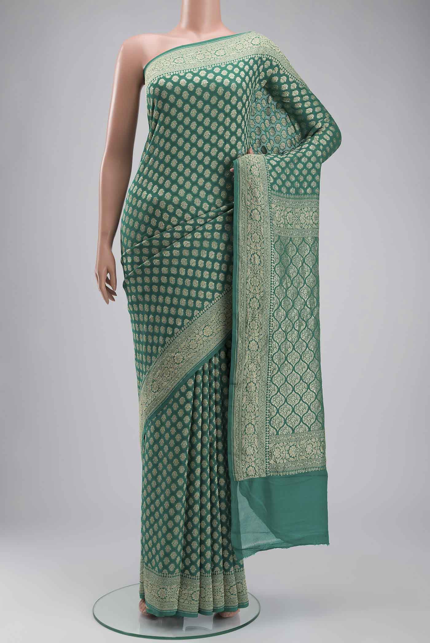 Green Banarasi Georgette Saree with Zari Butta on the body and Zari Border displayed on a mannequin