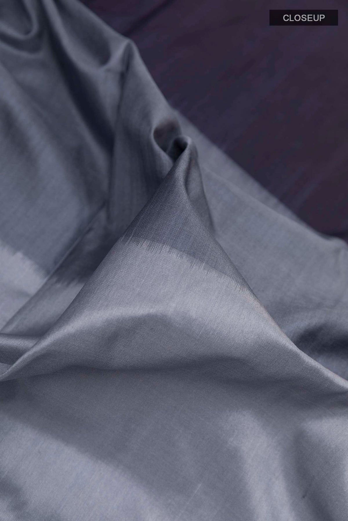 Close up of Multi Color Pochampally Silk Saree with Half And Half on the body and Zari Border displaying folds