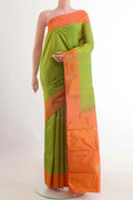 Green Kanchipuram Silk Saree with Zari Butta on the body and Zari Border displayed on a mannequin
