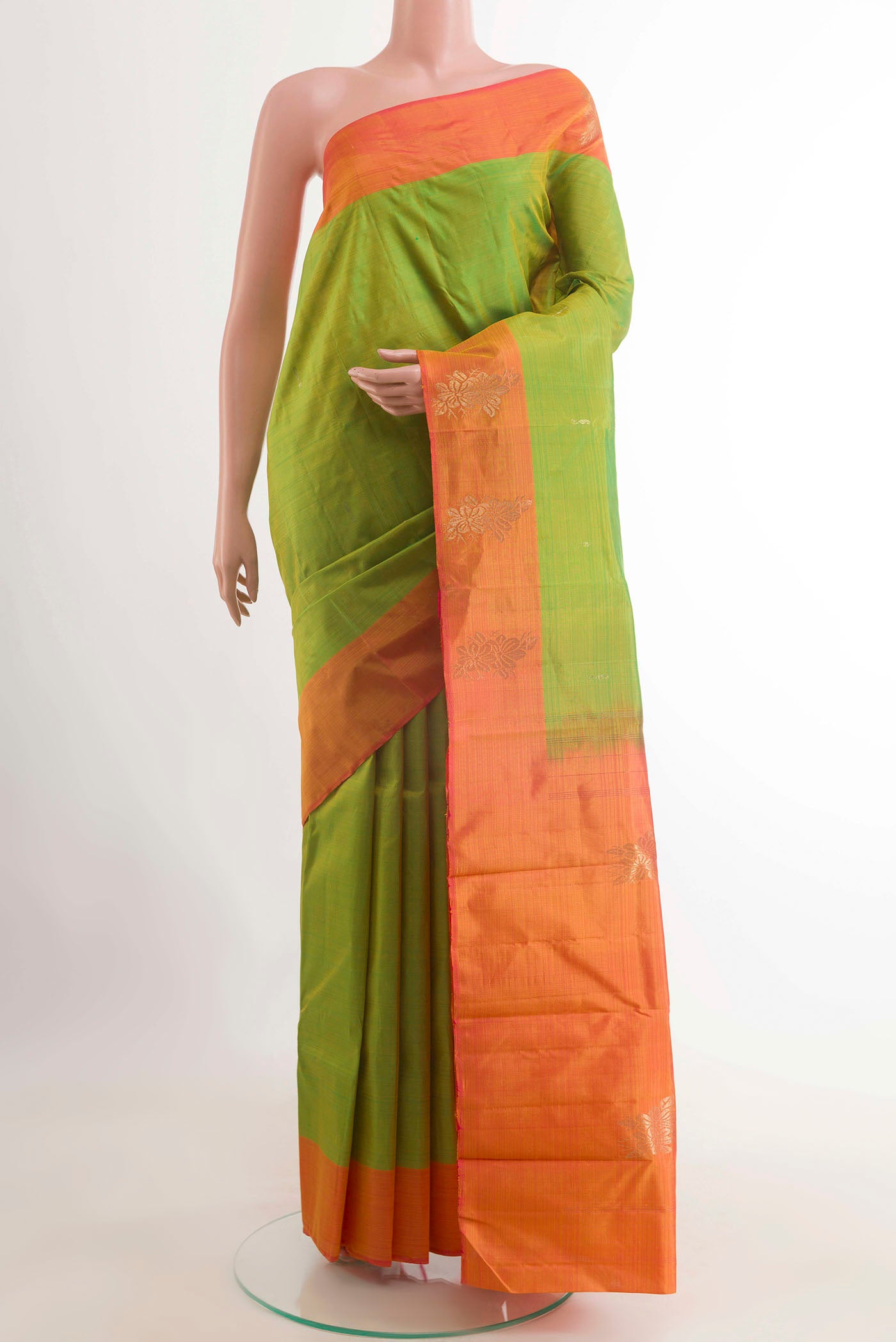 Green Kanchipuram Silk Saree with Zari Butta on the body and Zari Border displayed on a mannequin
