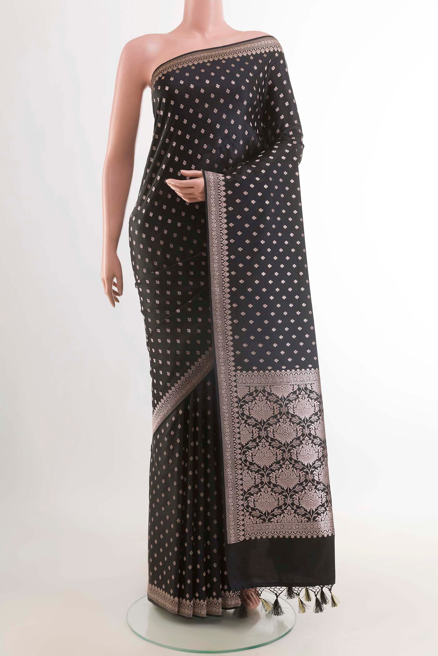 Black Art Silk Saree with Zari Butta on the body and Zari Border displayed on a mannequin