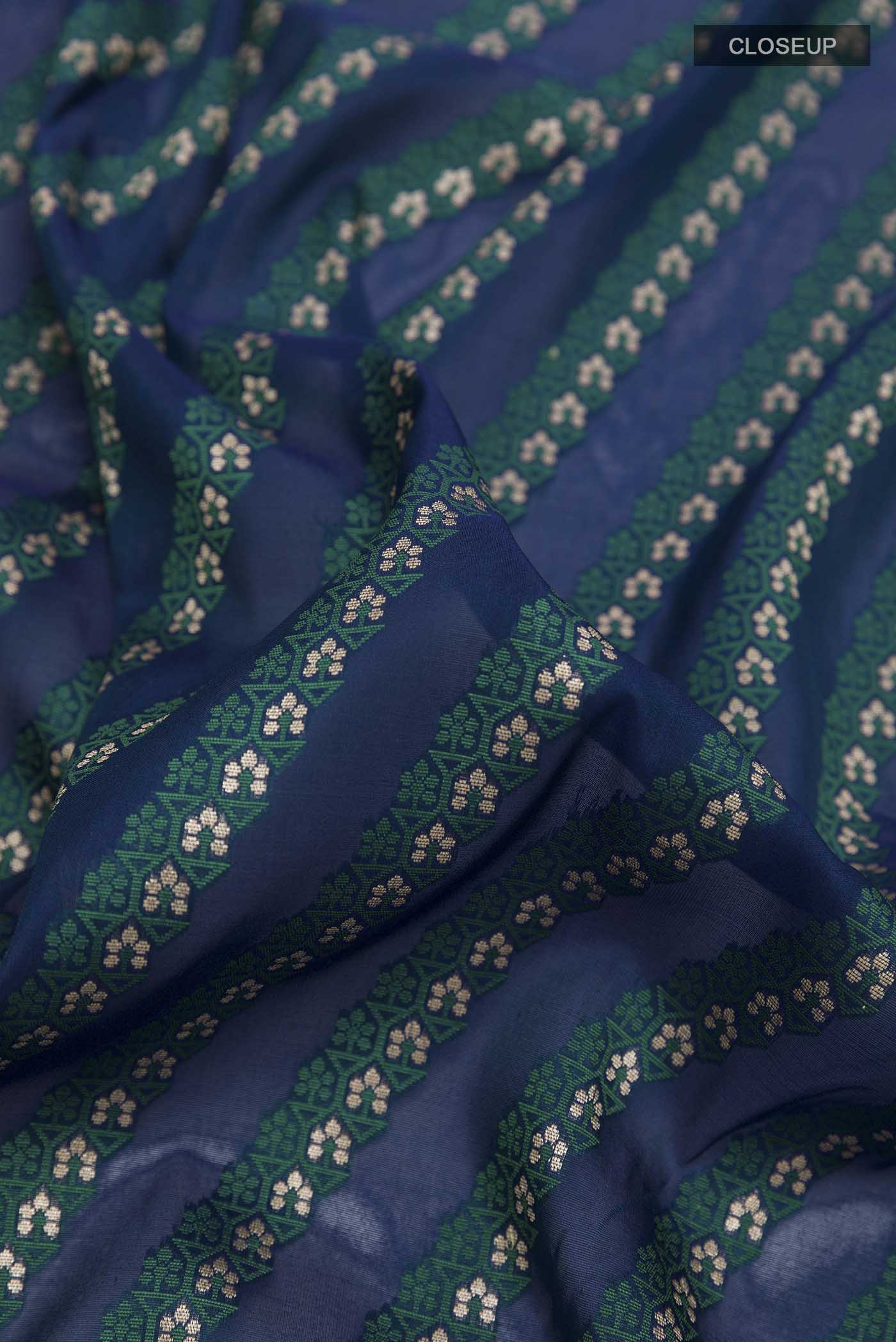 Close up of Blue Banarasi Silk Saree with Stripes on the body and Zari Border displaying folds