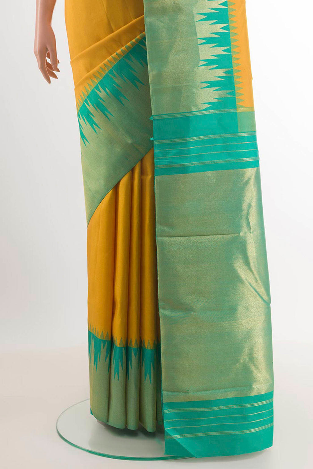 Pleats and pallu of Yellow Kanjivaram Silk Saree with Plain Body and Temple Border. 