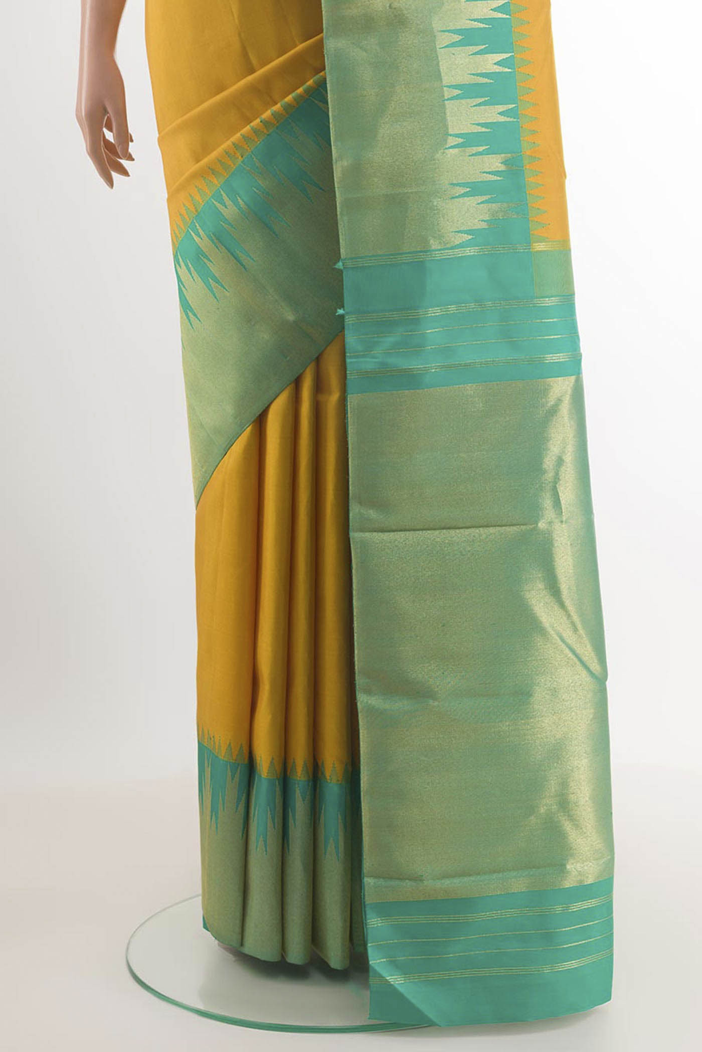 Pleats and pallu of Yellow Kanjivaram Silk Saree with Plain Body and Temple Border. 