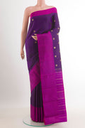 Purple Kanjivaram Silk Saree with Zari Butta on the body and Zari Border.  displayed on a mannequin