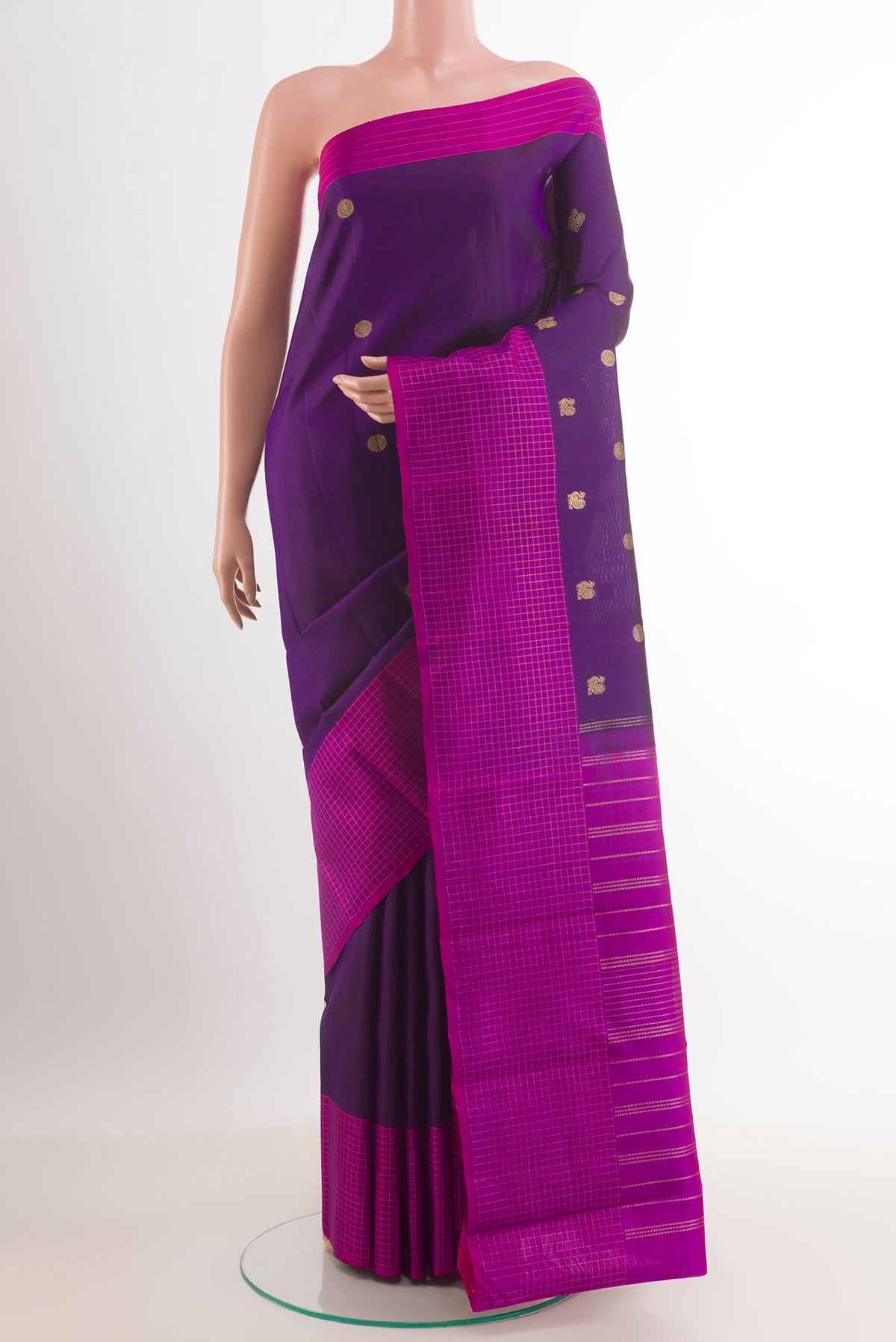 Purple Kanjivaram Silk Saree with Zari Butta on the body and Zari Border.  displayed on a mannequin
