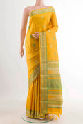Yellow Kanchipuram Silk Saree with Thread Butta on the body and Zari And Thread Border displayed on a mannequin