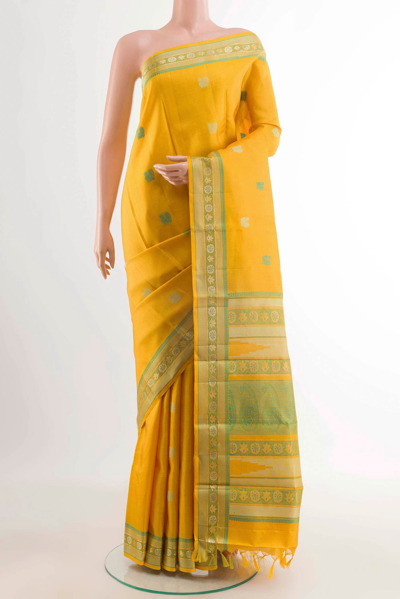 Yellow Kanchipuram Silk Saree with Thread Butta on the body and Zari And Thread Border displayed on a mannequin