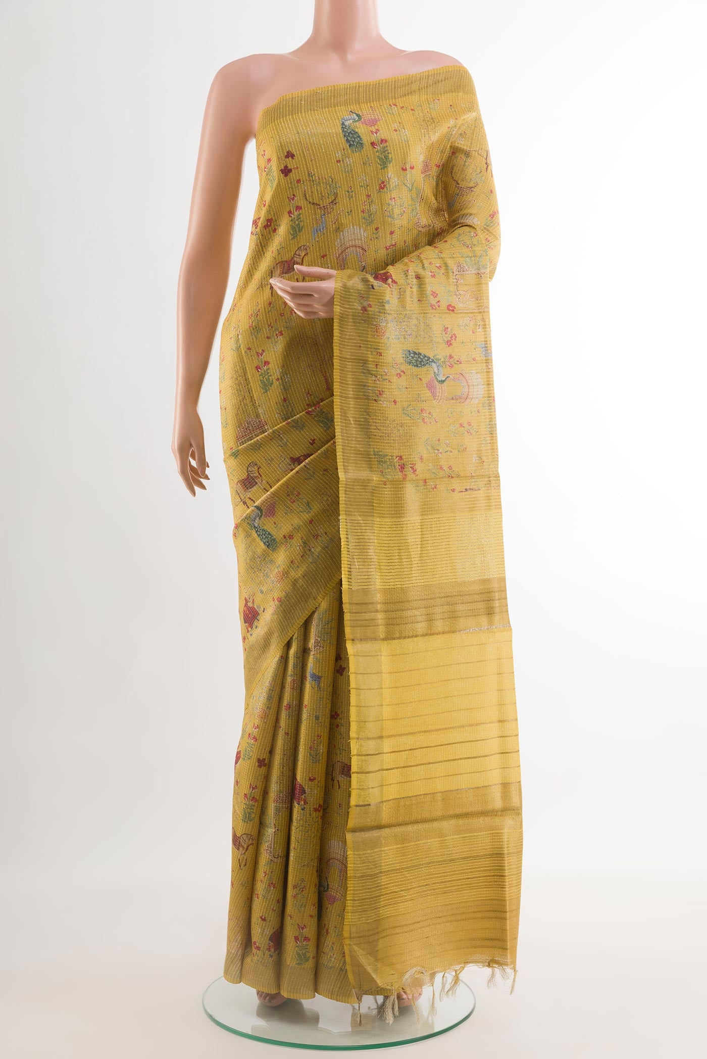 Yellow Tussar Silk Saree with Printed design on the body and Zari Border.  displayed on a mannequin