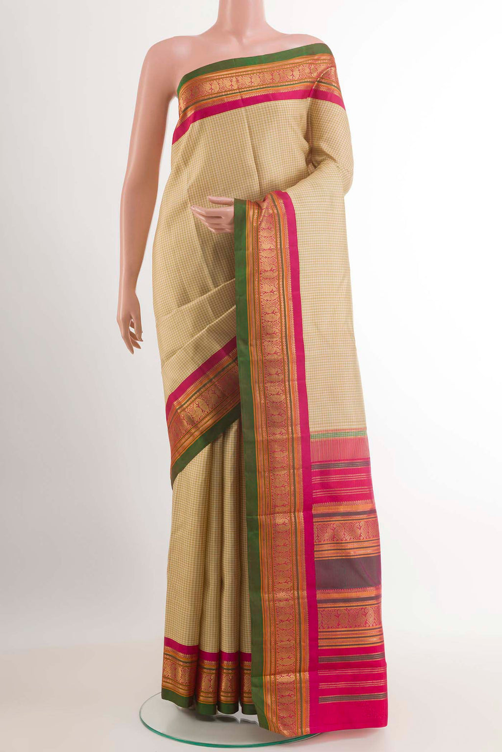Olive Green Kanjivaram Silk Saree with Checked design on the body and Ganga Jamuna Border.  displayed on a mannequin