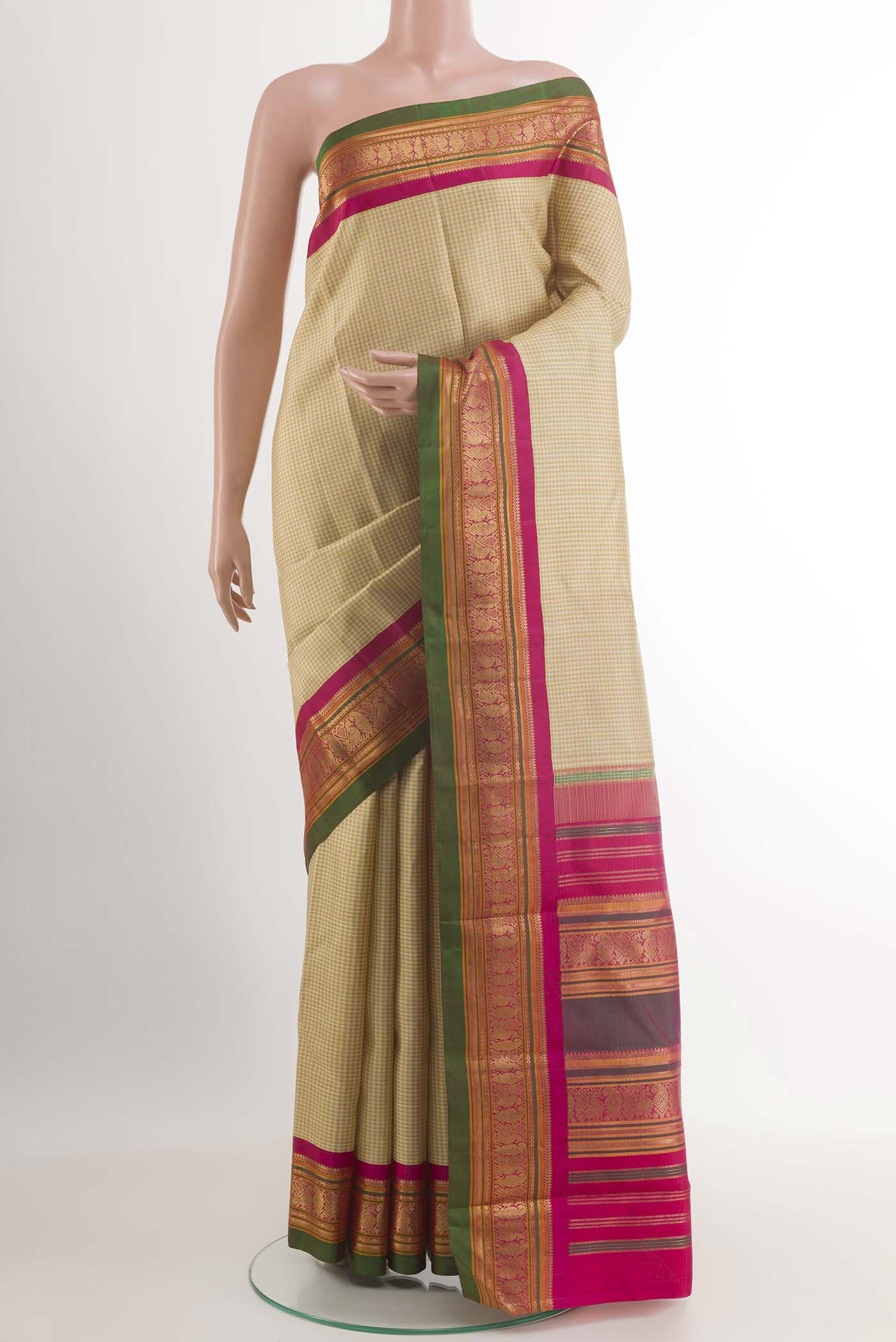 Olive Green Kanjivaram Silk Saree with Checked design on the body and Ganga Jamuna Border.  displayed on a mannequin