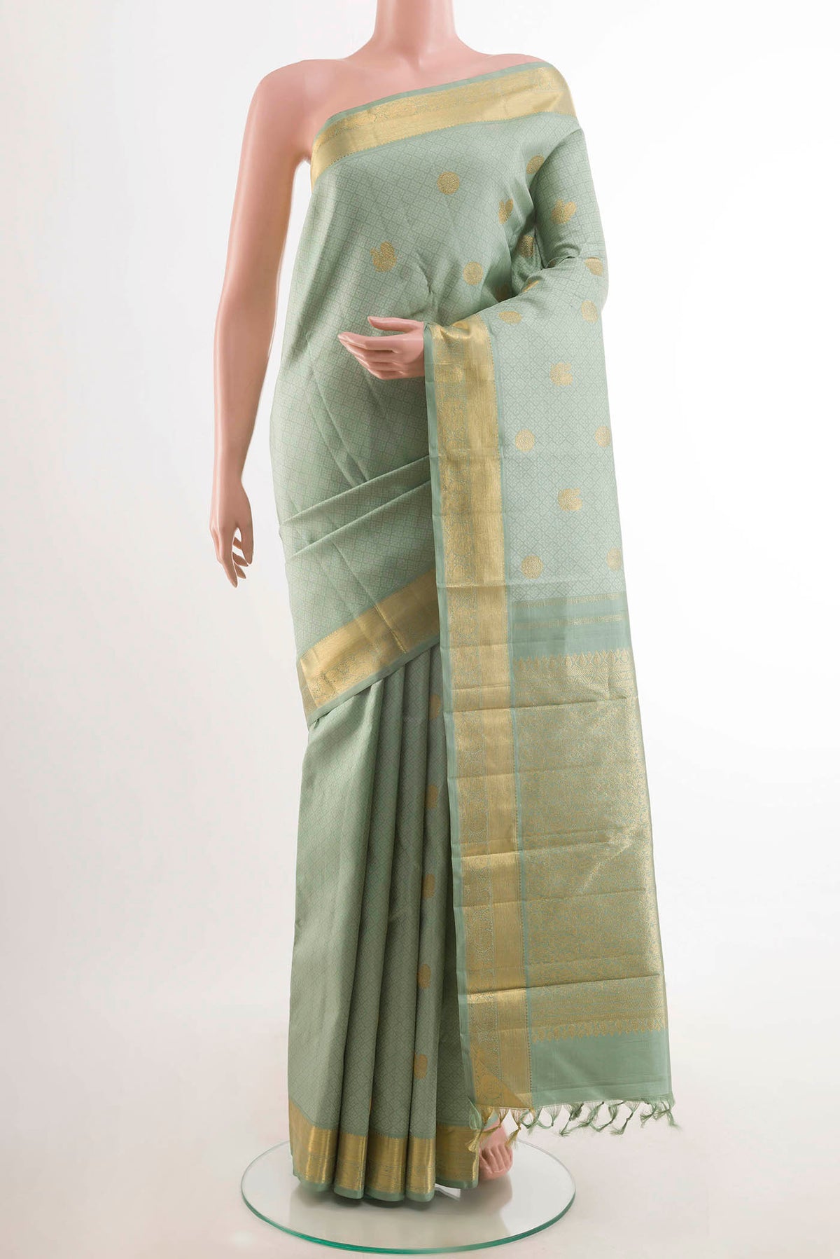 Sea Green Kanchipuram Silk Saree with Jacquard With Zari Butta on the body and Zari Border displayed on a mannequin