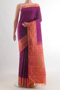 Pure Silk Purple Kanchipuram Saree with Plain Body and Zari Border.  displayed on a mannequin