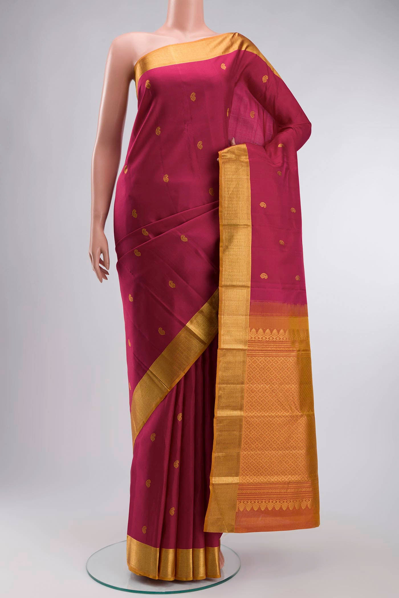 Pink Kanchipuram Silk Saree with Zari Butta on the body and Zari Border displayed on a mannequin