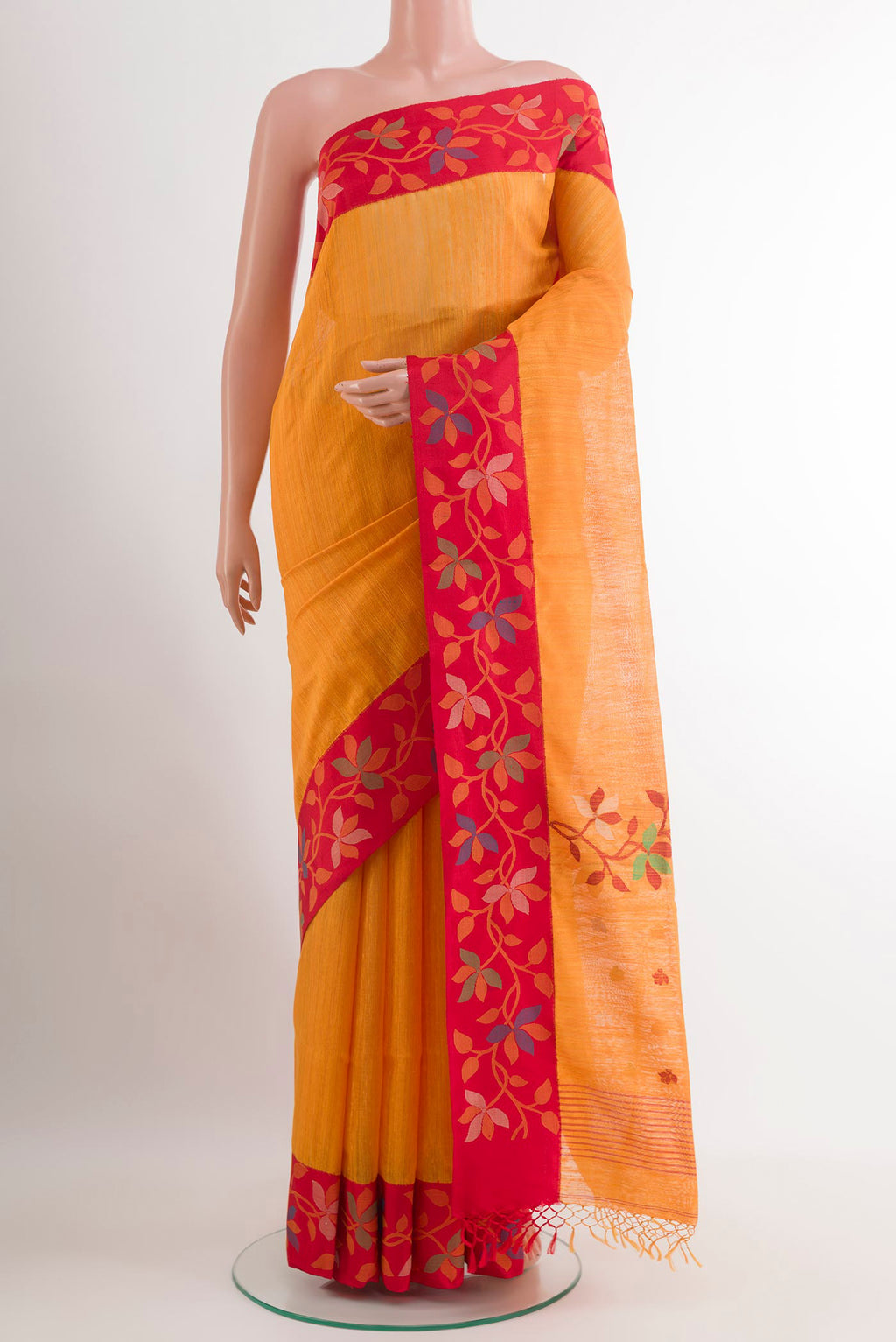 Yellow Raw Silk Saree with Thread Butta on the body and Thread Embroidery Border.  displayed on a mannequin