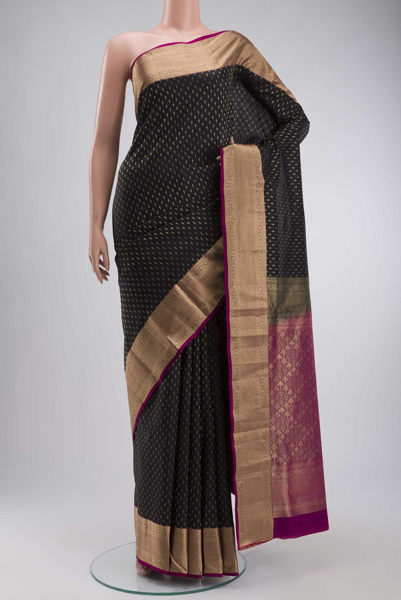 Black Soft Silk Saree with Zari Butta on the body and Zari Border displayed on a mannequin